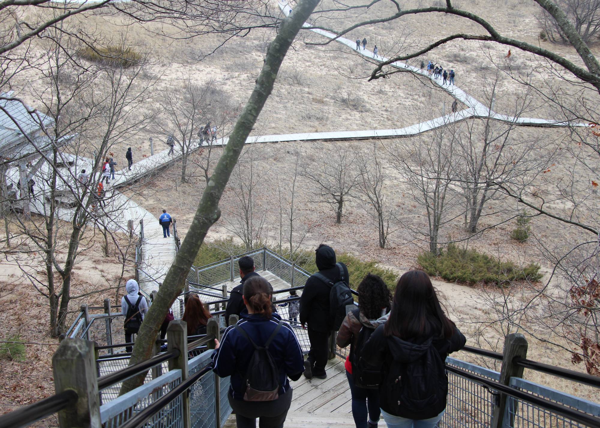 Students walking down stairs to Lake Michigan